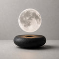 Hoverstone Lunara Moon Lamp floating above a black stone base