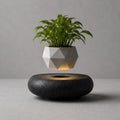 Hoverstone Lyfe Planter floating above a black stone base