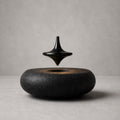 Hoverstone Orbit Top floating above a black stone base